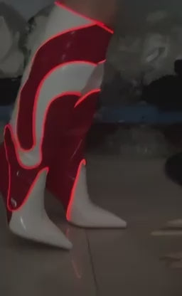 Glow Swirl light-up boots glowing red, side view while walking